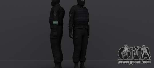 A riot police officer wearing a mask